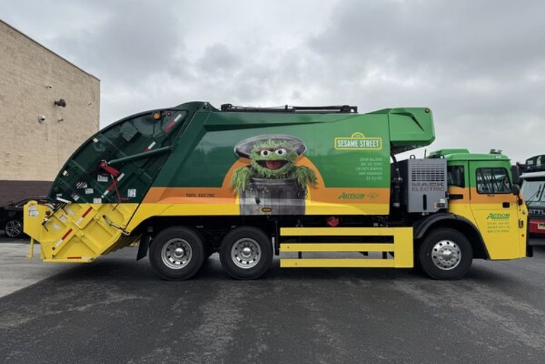 Action Carting unveils electric truck with Oscar mascot